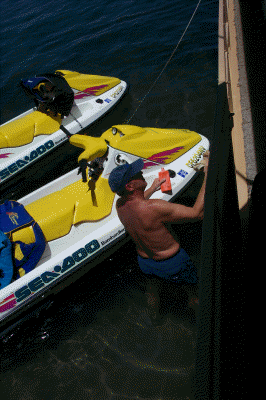 Mike waxing the houseboat