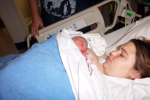 I'm in bed with mom in the hospital