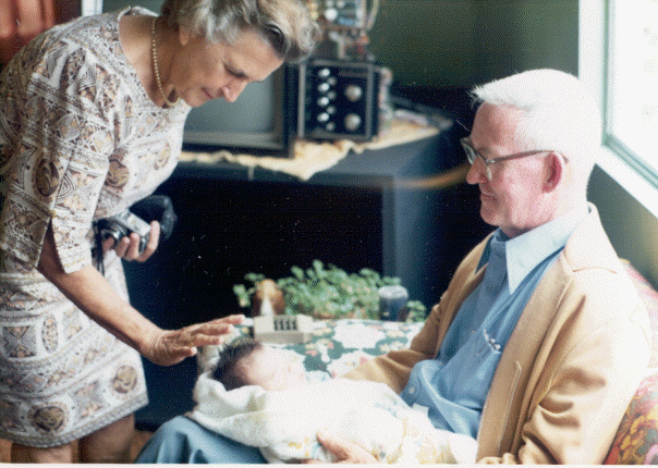 With my papa and mama of the pool